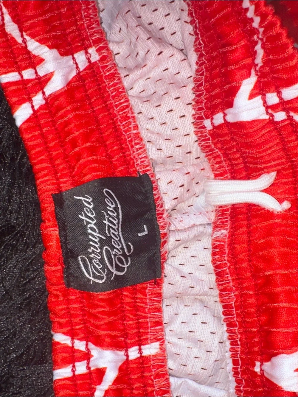 Men's Red Athletic Shorts with White Web Graphic